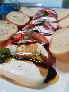 A plate of food with bread and sauce.